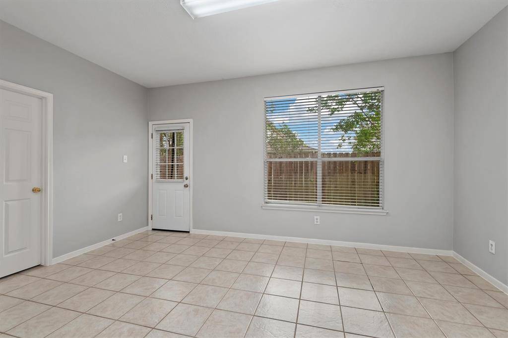 As we move outside, here is another view of the dining area, the laundry room to the left.