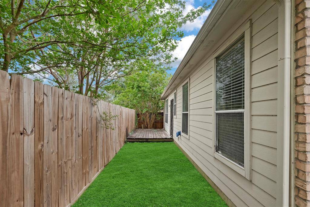 Out back, there is a fitting deck which is perfect for cooking out and relaxing and just enough space for Fido....