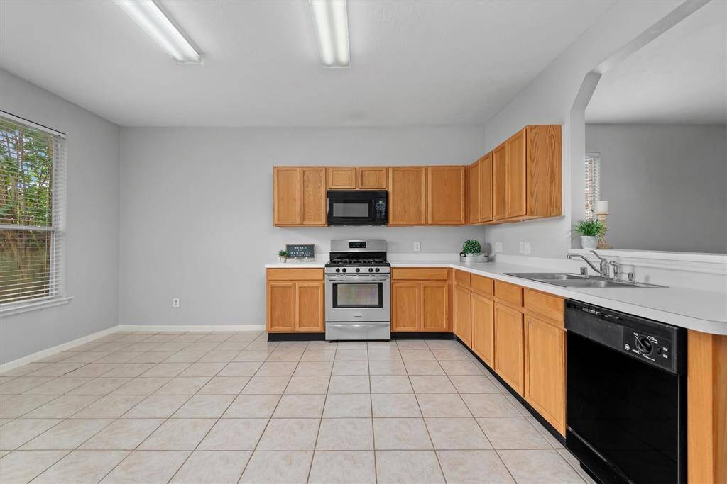 Here is a sneak peek at the super spacious kitchen and dining area- all open to the family room to the right.