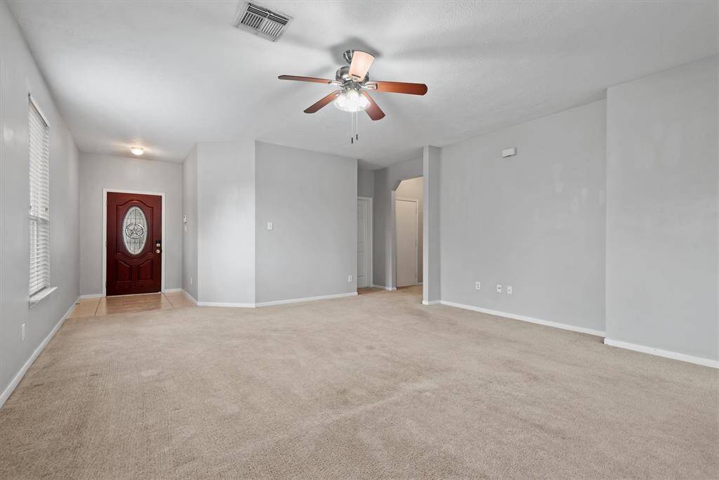 Here is another view looking at the front of the home from the family room. This large room is perfect for all your furnishings and big screen TV.