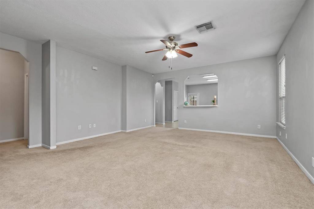 Again, to the left is the hallway leading to the secondary bedrooms and full bath. The bathroom is conveniently located for guests.