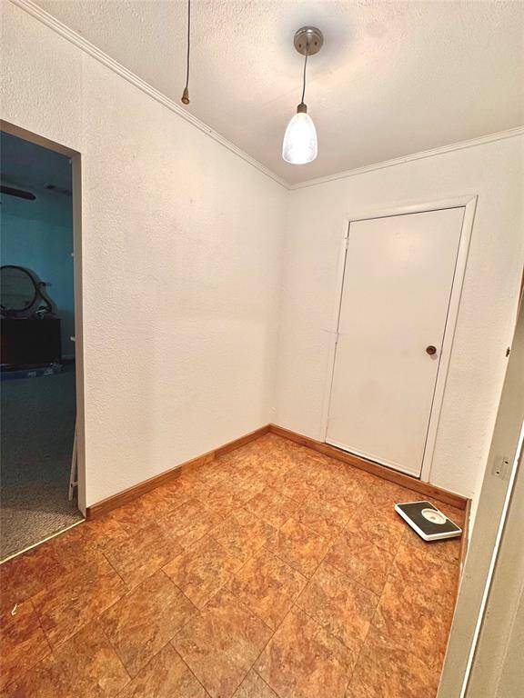 Mud room with access to the back yard.