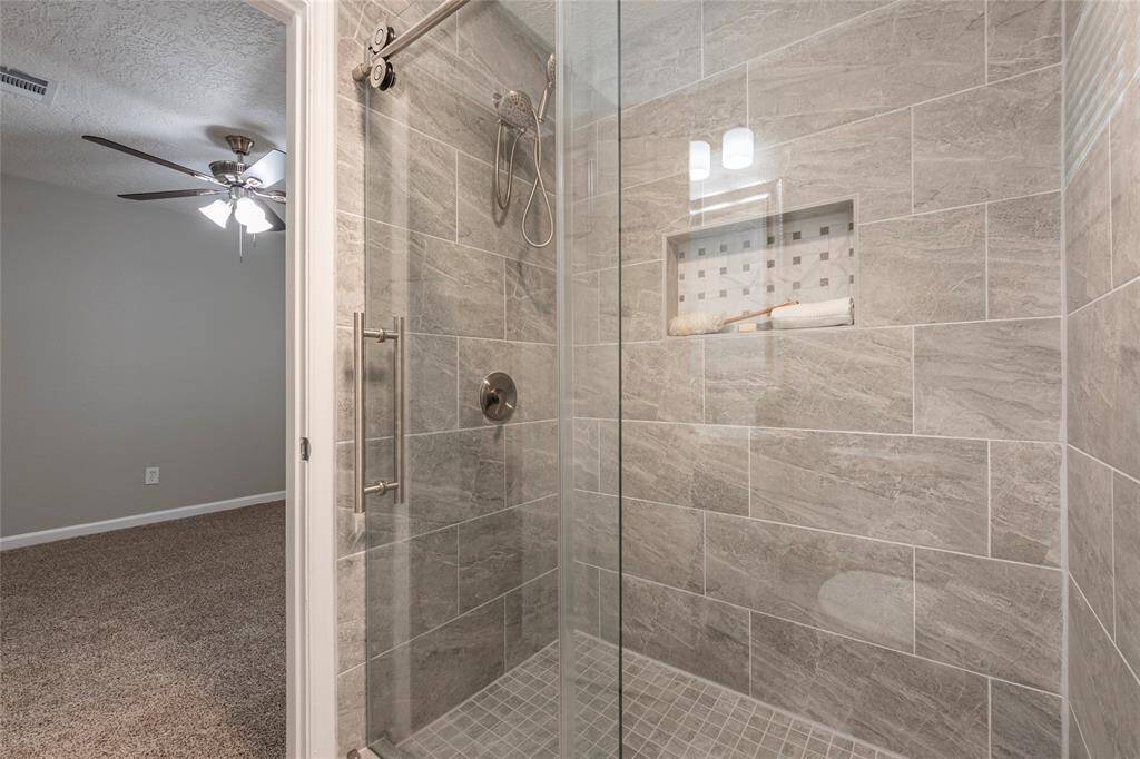 Primary Bathroom with custom tiled walk-in shower