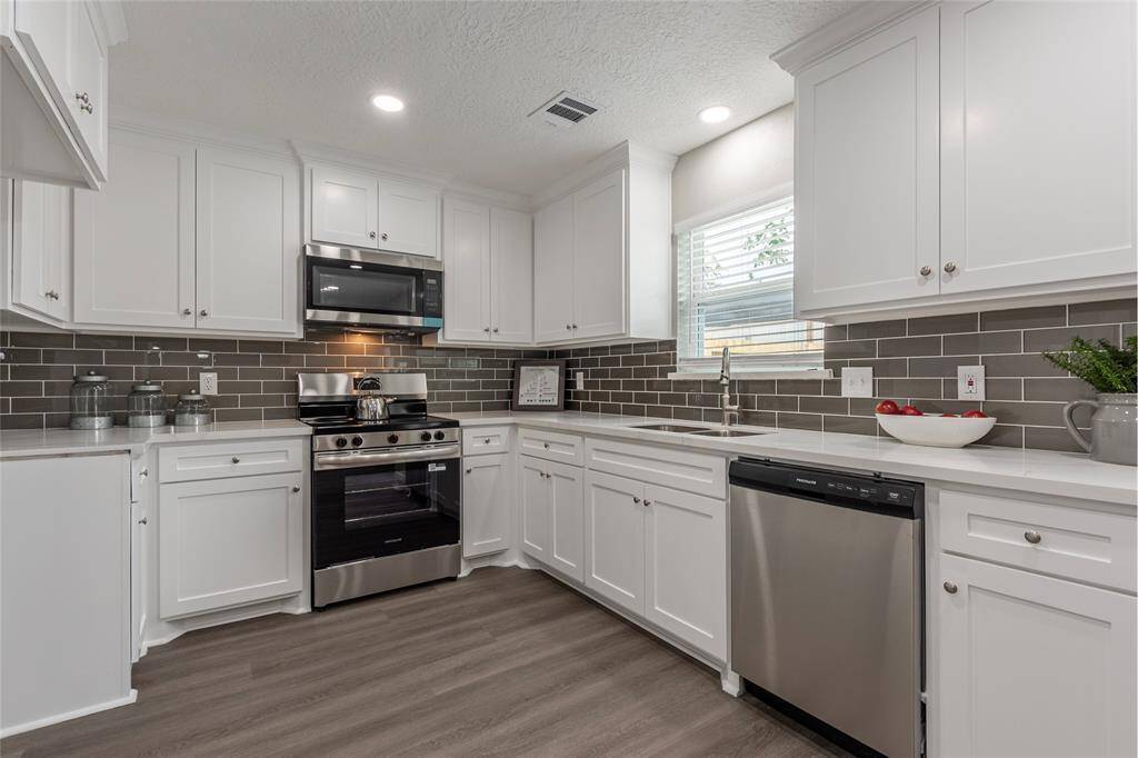 Kitchen area with custom wood cabinetry