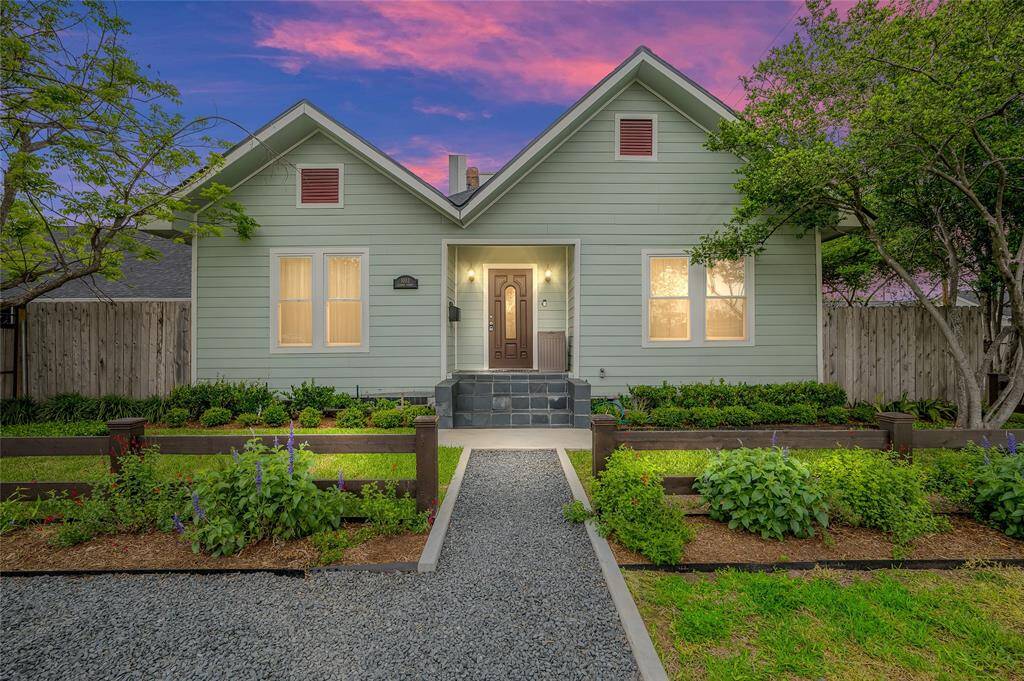 Greater Heights area cottage on a corner lot with a new roof, fresh paint, huge garage,  fenced yard and more!