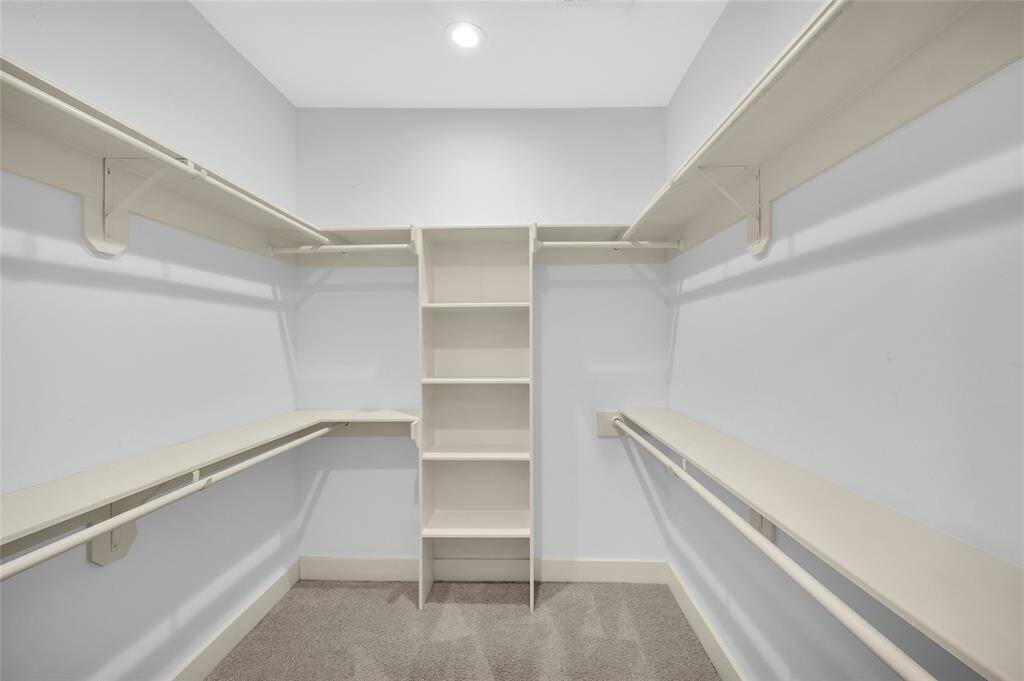 Large primary walk in closet just off the bathroom.