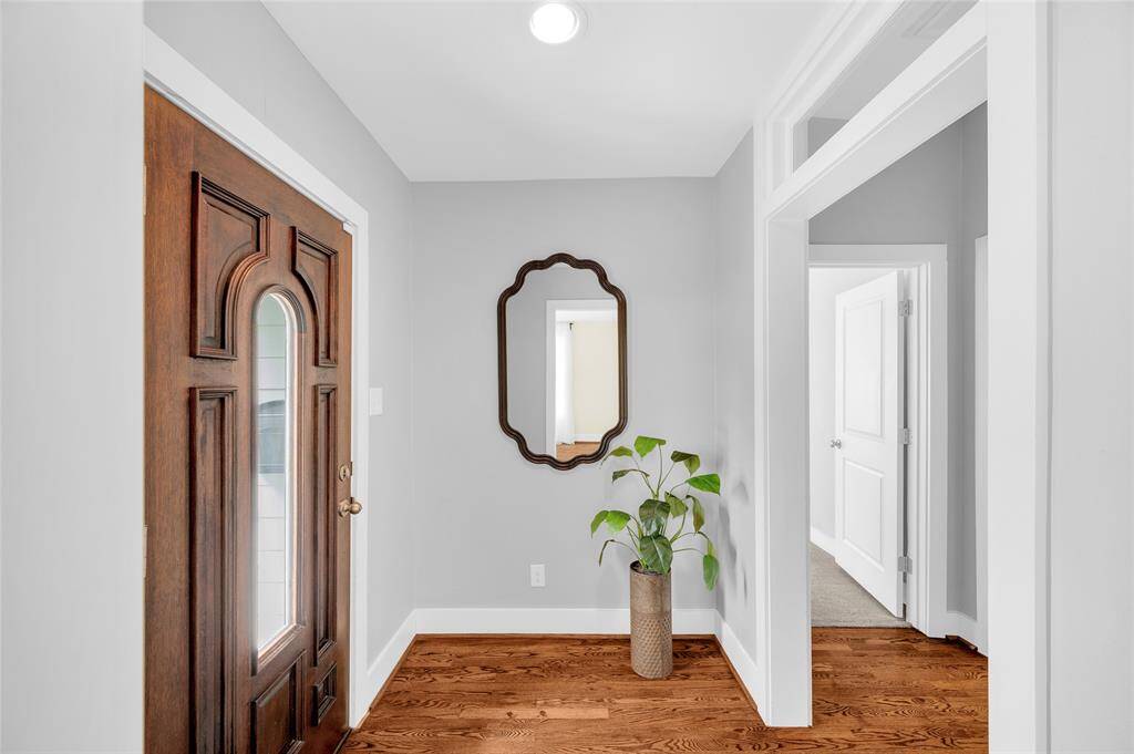 The front entryway with transom leading to the home office and front bedroom.