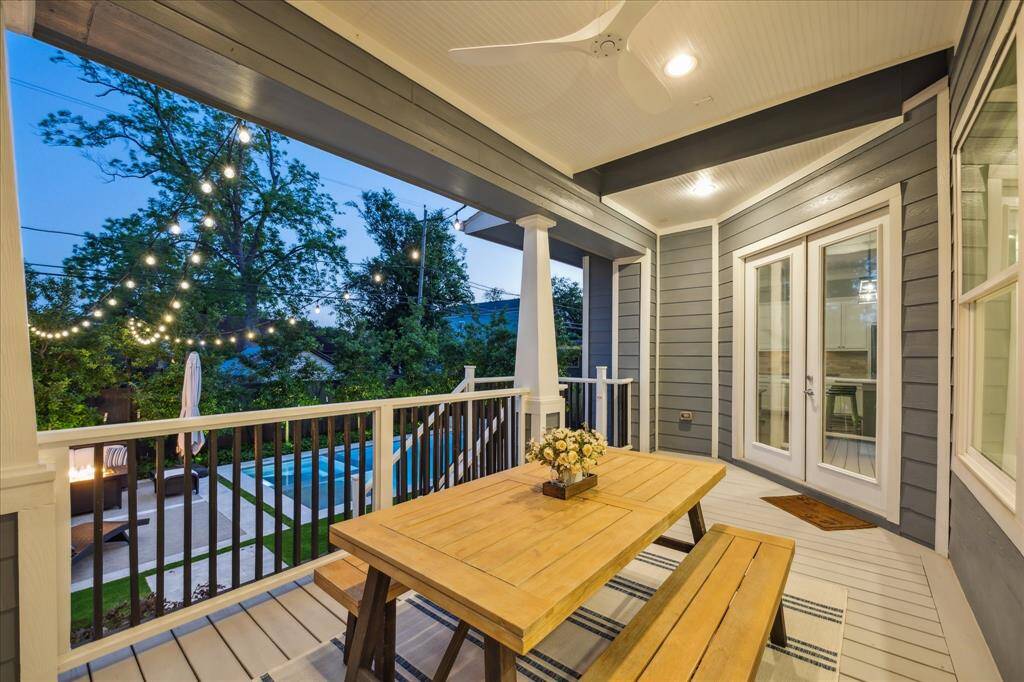 Wonderful setup for outdoor dining and entertaining. Covered patio includes a summer kitchen with built-in grill and updated modern ceiling fan.