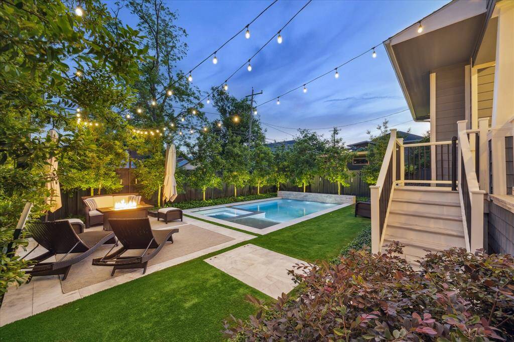 Ample green space and seating areas surrounding the pool. Removable mesh safety gate not pictured.