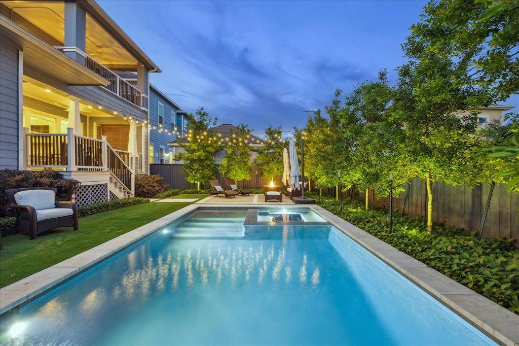 Glistening pool and spa are both heated for year round enjoyment. Beautiful trees provide an extra layer of privacy.