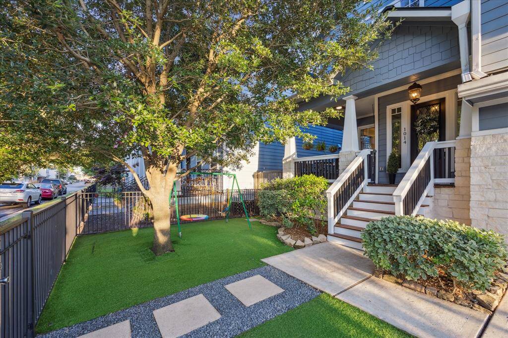 Fully fenced front yard with turf is perfect for a play space or pets.