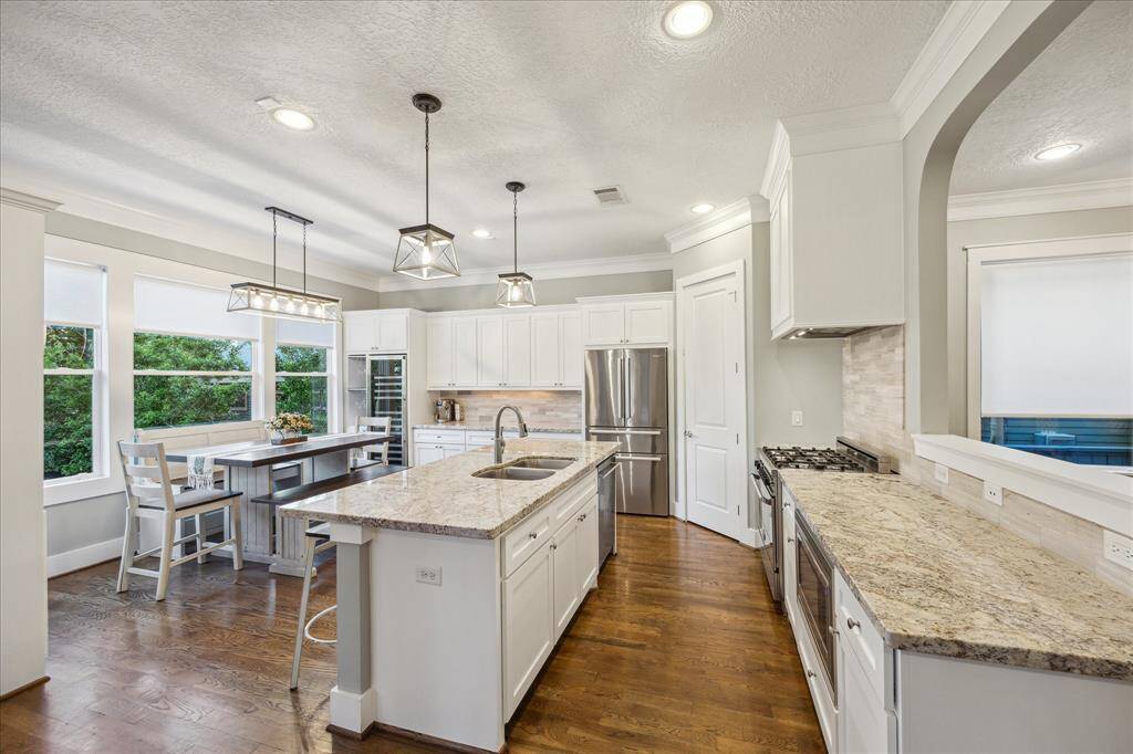 KITCHEN II - Another perspective of the kitchen with a walk-in pantry, full size wine fridge and breakfast room.