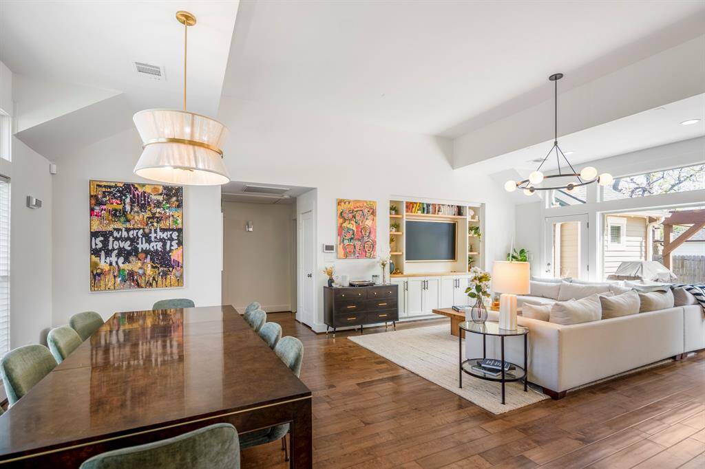 Open-concept flow between living, dining, and kitchen makes everyday living seamless.