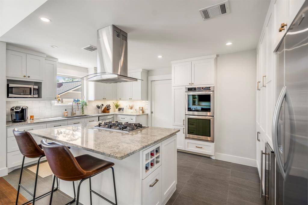 Breakfast bar space designed for connection, conversation, and comfort.