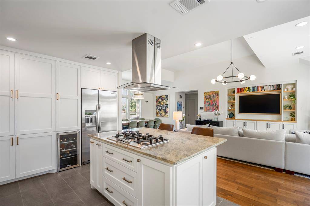 Custom cabinetry and stainless steel appliances offer storage and style in equal measure.
