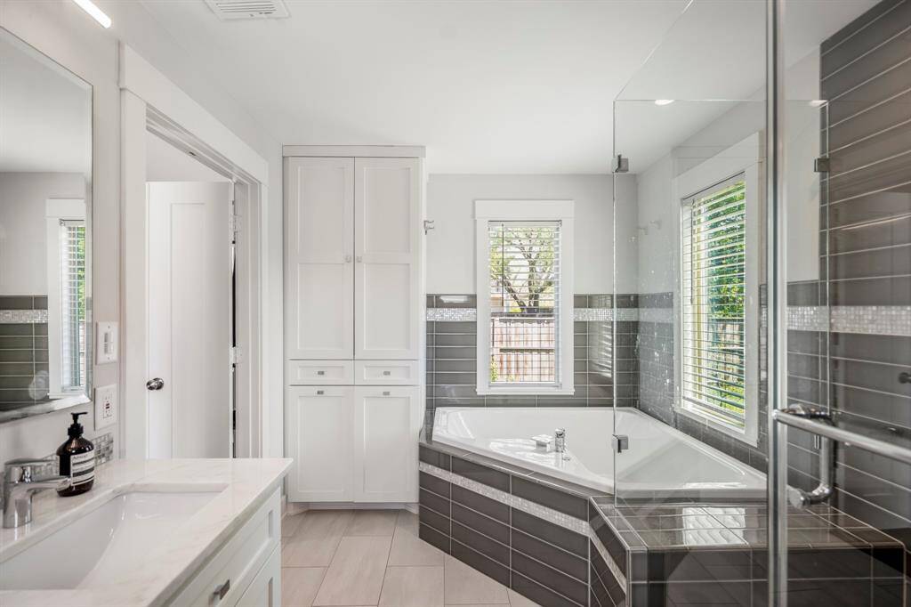 Unwind in style with a deep soaking tub, walk-in shower, and dual vanities—your personal retreat awaits.