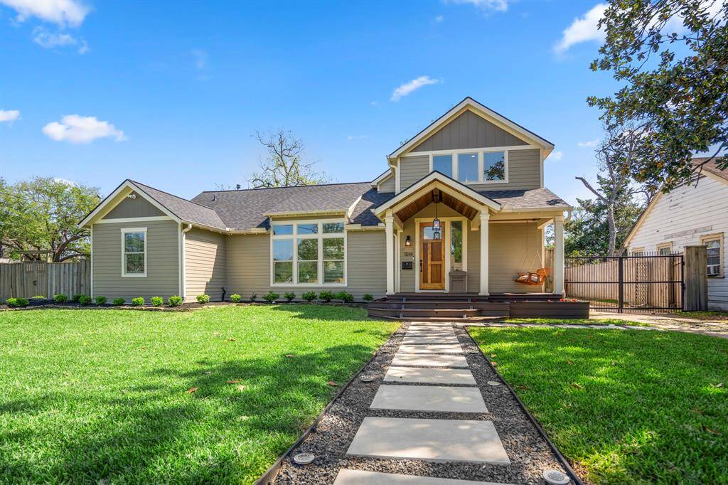 A welcoming front porch with designer lighting sets the tone for timeless style inside.
