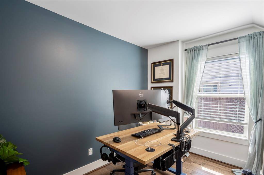 Third downstairs bedroom easily doubles as a nursery, home office, or creative space.