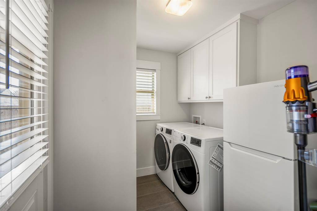 Oversized walk-in laundry room with plenty of elbow room and extra storage.