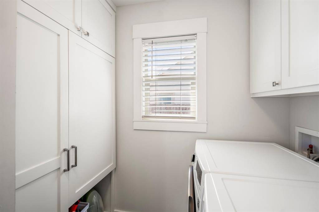 Utility meets style in this upgraded laundry retreat—no detail overlooked.