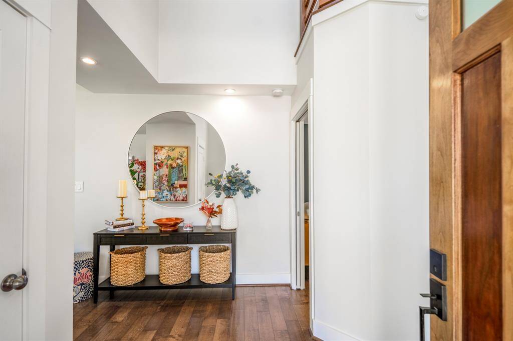 Soaring 12’ ceilings and wide-plank hardwood floors greet you with elegance and warmth.