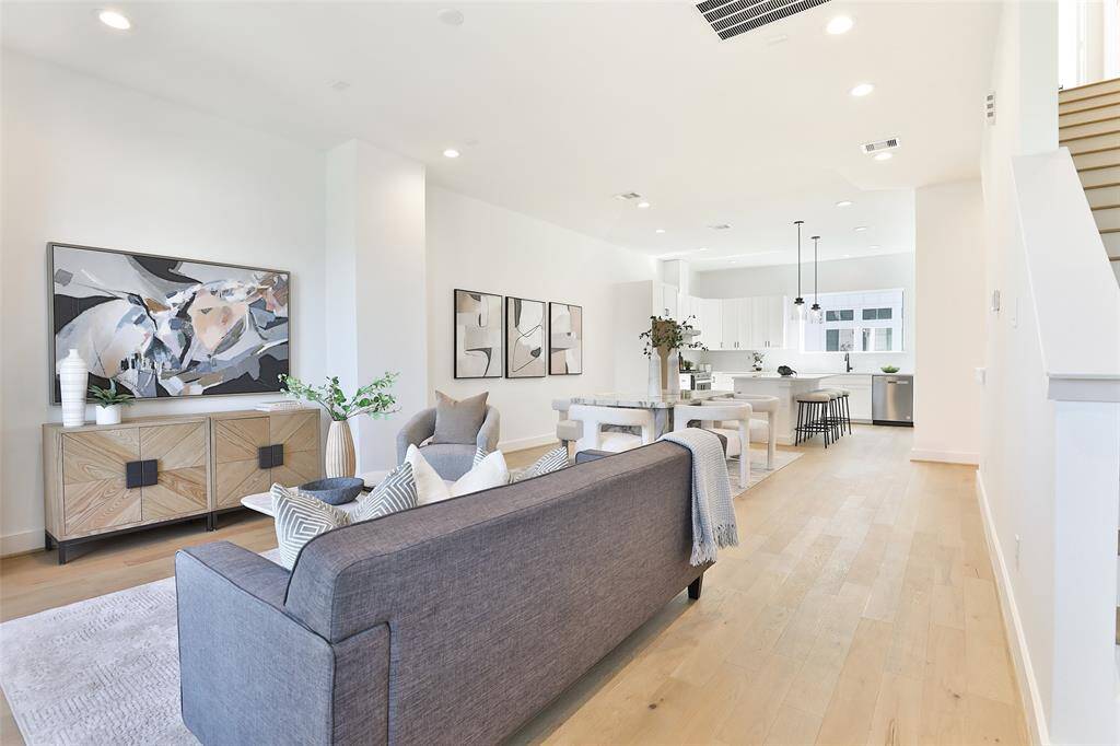 Relax and unwind in your spacious open-concept living area, offering plenty of room for both entertaining and cozy nights in.