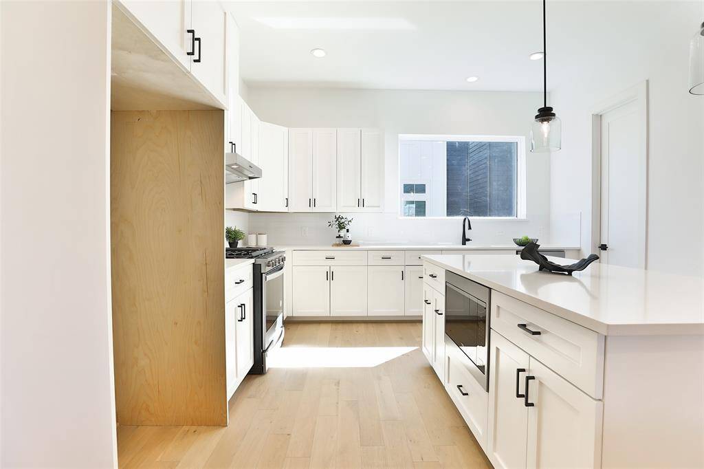 A built-in microwave seamlessly tucked away for a sleek, uncluttered look.