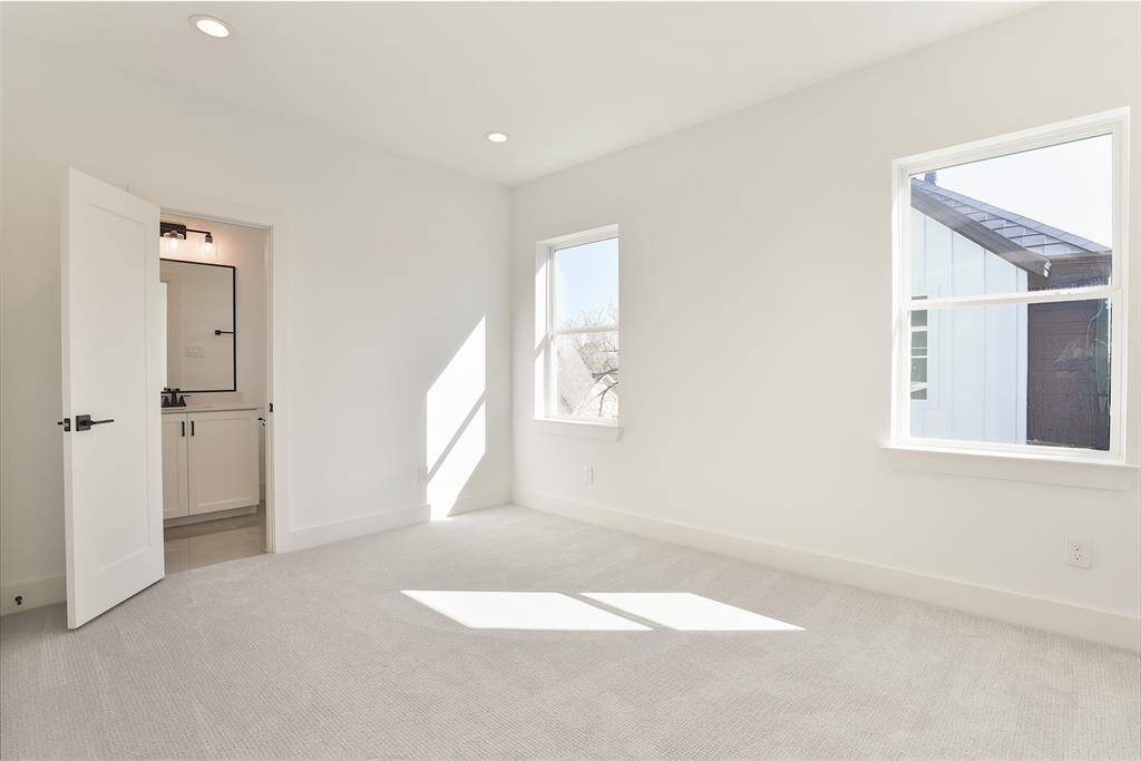 Relax in the cozy comfort of carpeted floors in this secondary bedroom.