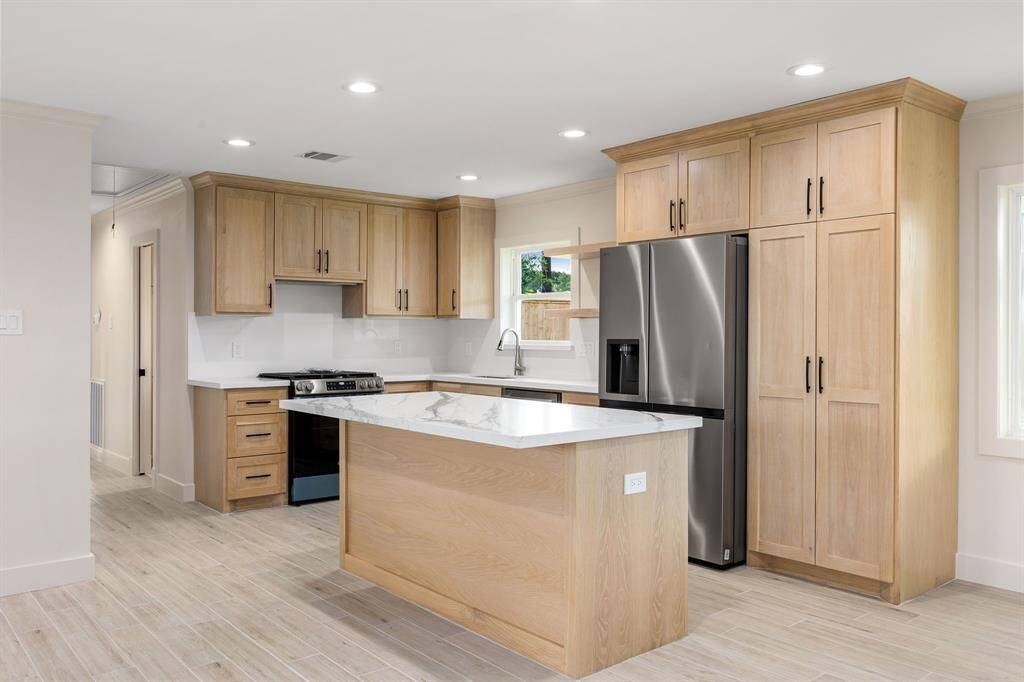 Custom Cabinetry w/ Quarts Countertop and new appliances. Check out the microwave when you visit!