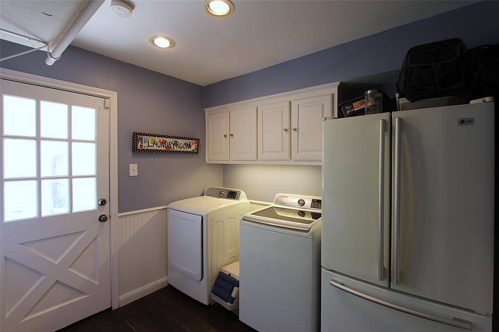 Laundry is located near the kitchen and has a door leading to the back yard