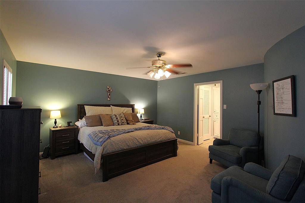 Downstairs bedroom has room for a king sized bed, dressers, and sitting area
