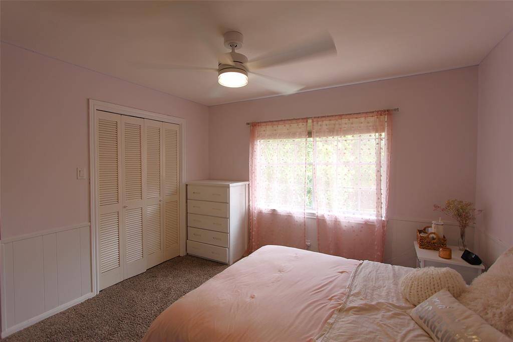 Natural light through large bedroom windows
