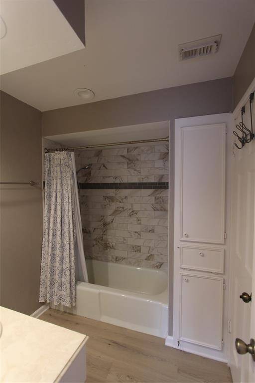 Updated tile and flooring in second upstairs bath
