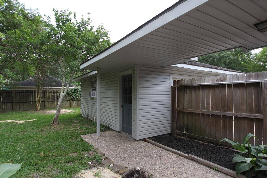 Covered walkway to the detached garage