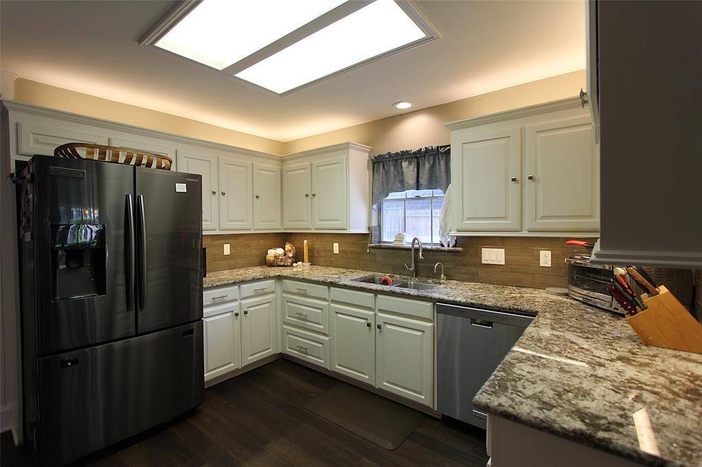 Kitchen has updated appliances and updated granite countertops