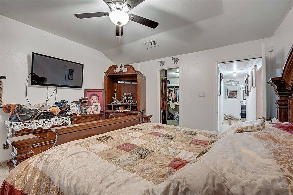 Primary Bedroom with door connecting to the second bedroom that has been used as a closet