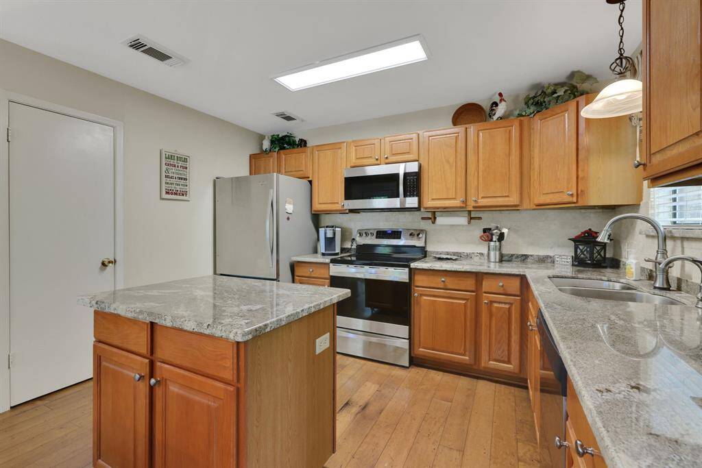 The kitchen has a walk in pantry