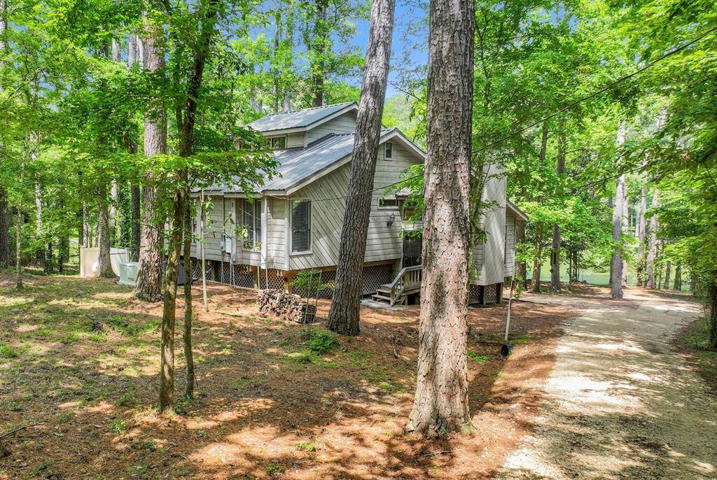 The home sits on a spacious 0.4 acre lot with approx 130ft of waterfront bulkhead