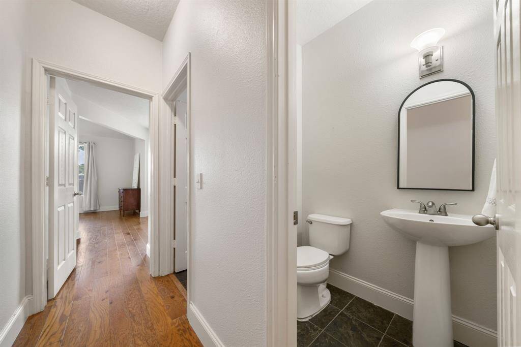 Powder room for guests in hallway off living room