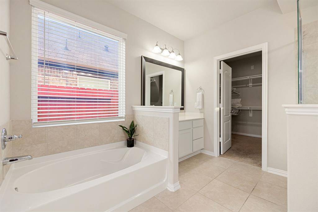 Highlighted by a garden tub and a seperate shower.
