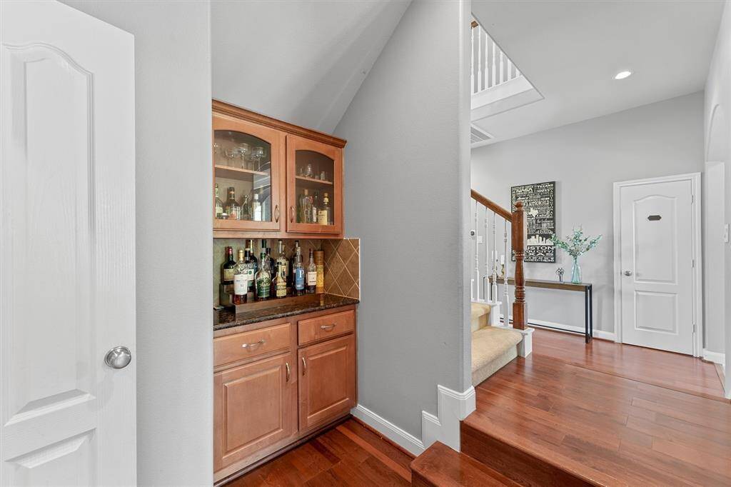 Right off the formal dining there is a custom built in dry bar, perfect for cocktail nights or casual hosting.