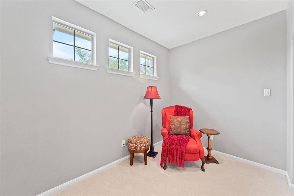 Cozy upstairs sitting nook at the top of the stairs is ideal for reading, relaxing, or studying