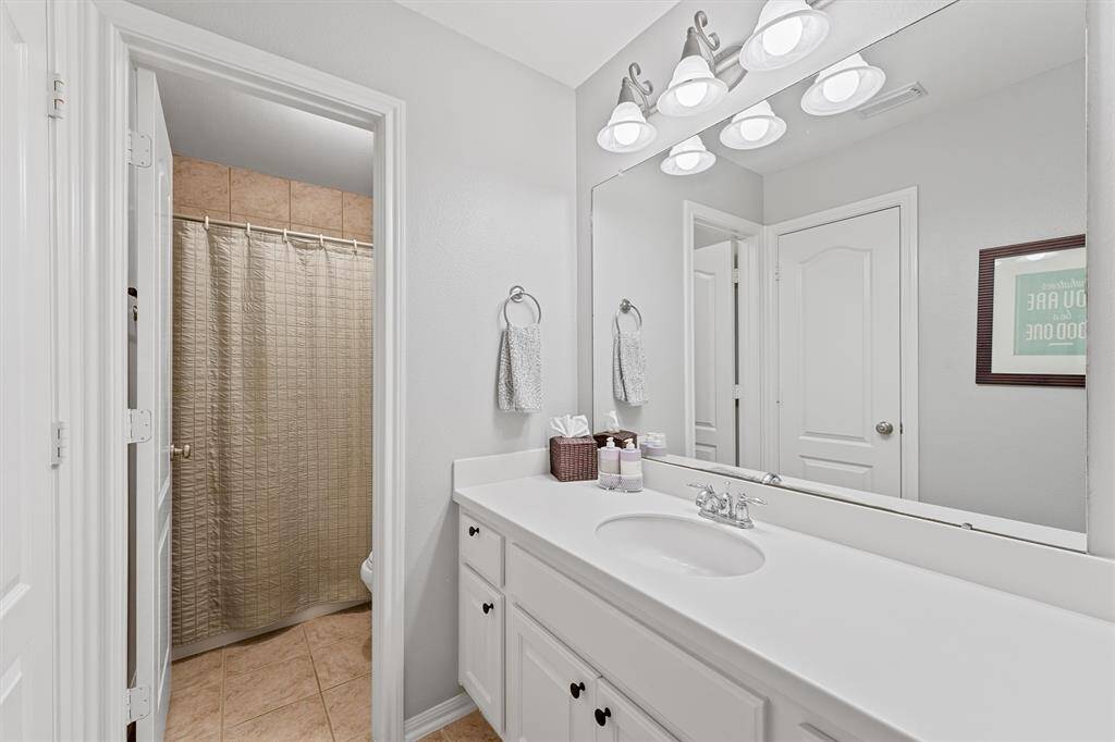 One of the two bathrooms upstairs with plenty of counterspace.