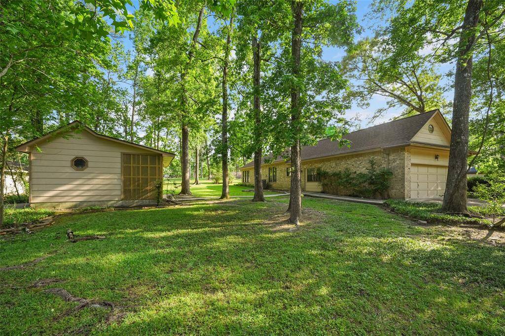 Property sits on double lot and is complete with a detached golf cart garage.