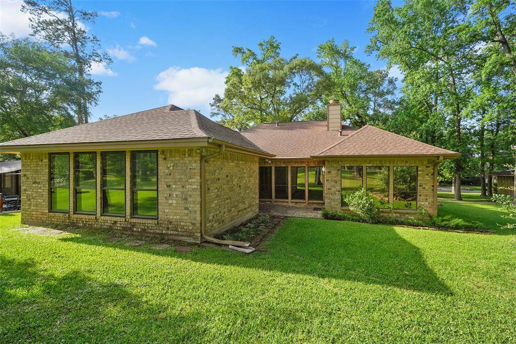 Rear elevation with quaint patio - notice the gutters.