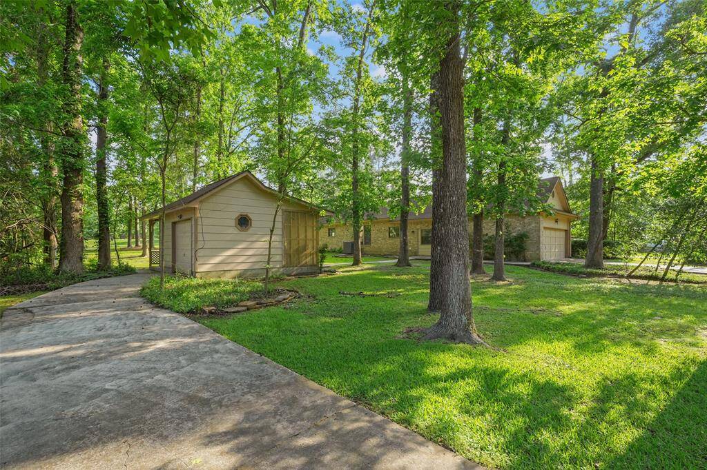 Golf cart garage has separate driveway.