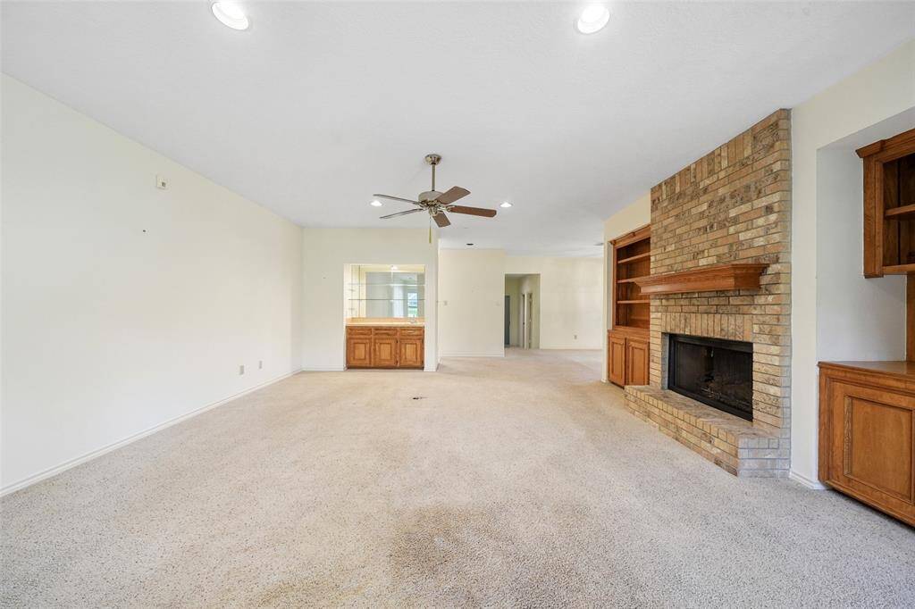 Notice the wet bar, built-ins and recessed lighting.