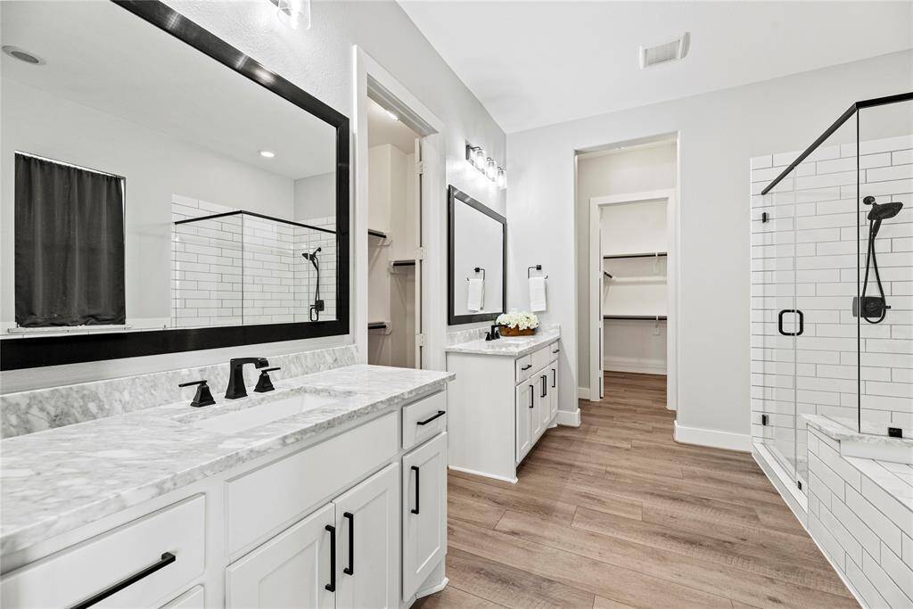 Dual vanities in your primary bath, offer personal space with tons of dedicated cabinet space.