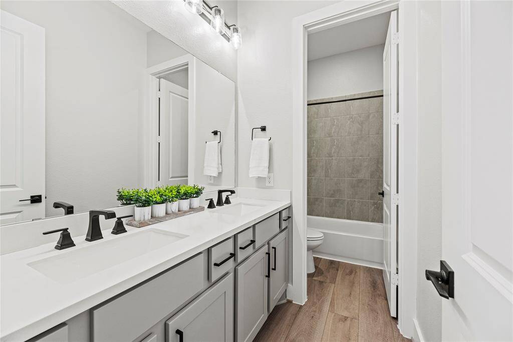 Practical comfort meets beautiful design in your full secondary bath.