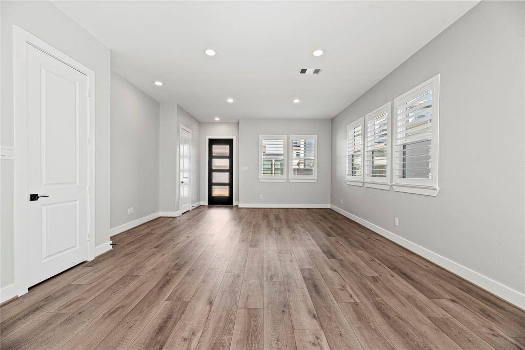 An alternate view of the gorgeous front foyer. Take a moment to admire the gorgeous easy care flooring that adds warmth and elegance to every step.